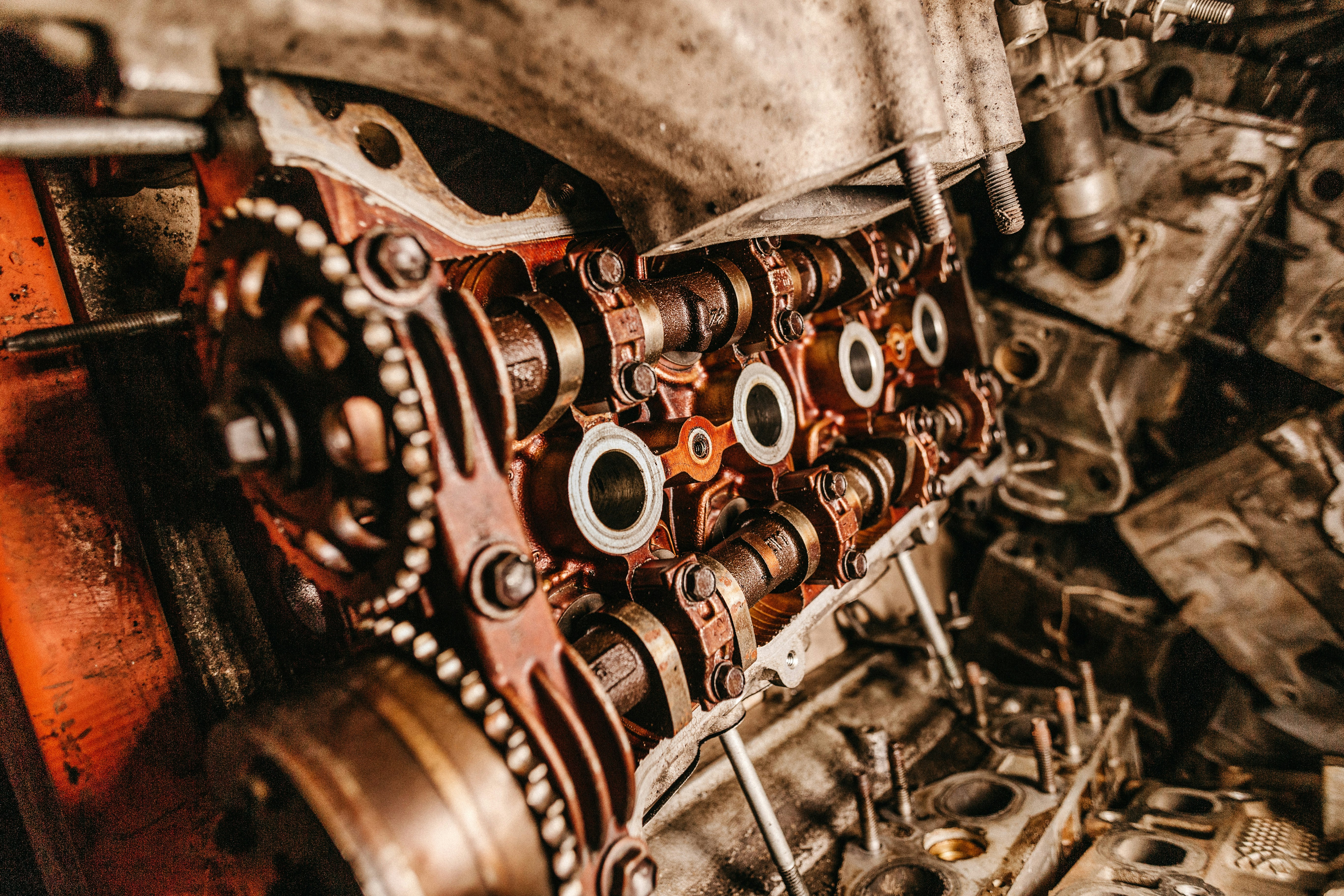 selective focus photography of gray and brass-colored metal parts